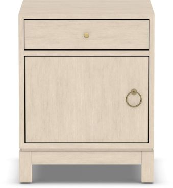 A sleek, handcrafted wooden nightstand with a light finish, featuring a single drawer and a cabinet with a brass ring handle for elegant bedroom storage.