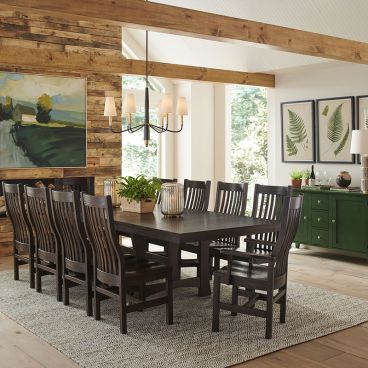 Spacious mission-style dining table with matching slatted chairs in a rustic dining room
