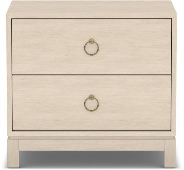 A handcrafted solid wood nightstand in a light finish, featuring two spacious drawers with elegant brass ring handles for stylish bedroom storage.