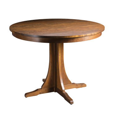 A handcrafted round wooden dining table with a sturdy pedestal base, featuring a smooth, polished surface in a rich, natural wood tone.