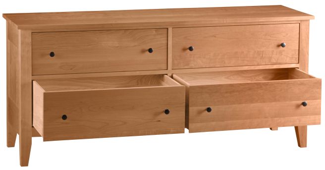 A handcrafted solid cherry wood dresser with four spacious drawers, featuring dovetail joinery and smooth undermount glides for effortless operation.