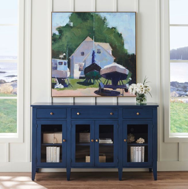 Solid wood media cabinet hand glazed in a midnight blue with glass doors.