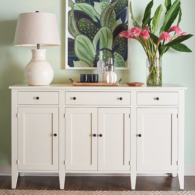 Solid wood server cabinet painted white.
