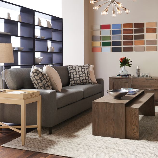 Wooden coffee table and media console in a contemporary living room, showcasing craftsmanship and minimalist style.