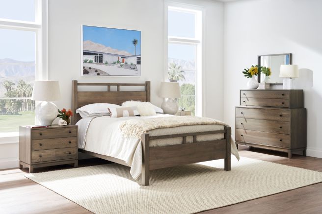 Natural wood grain bed frame and storage pieces styled in a modern interior.