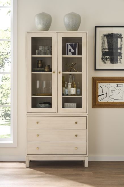 Elegant Gerard Glass Cabinet featuring clean lines and wooden craftsmanship with display shelves for decorative accents.