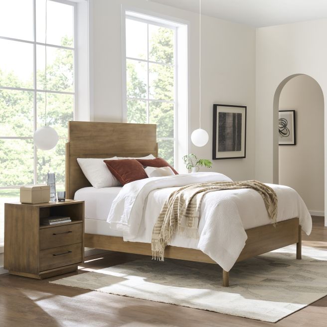 Solid wood bed paired with a matching  wooden nightstand, showcasing clean lines and solid craftsmanship for a contemporary bedroom setting.