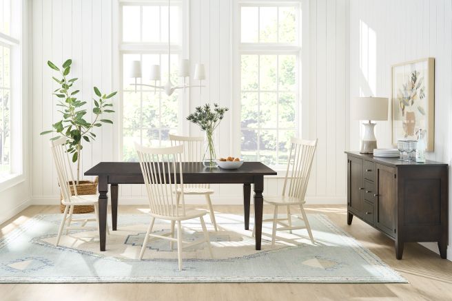 Stylish dining area showcasing a wooden table and cream-colored chairs.