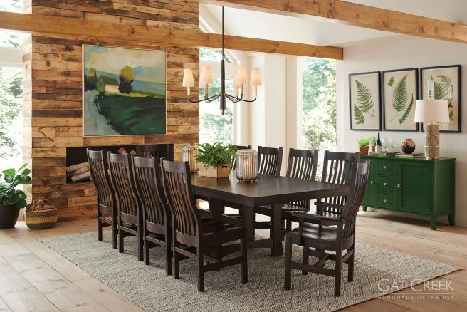Elegant handcrafted wooden dining set featuring a dark wood table and chairs in a warm, nature-inspired space